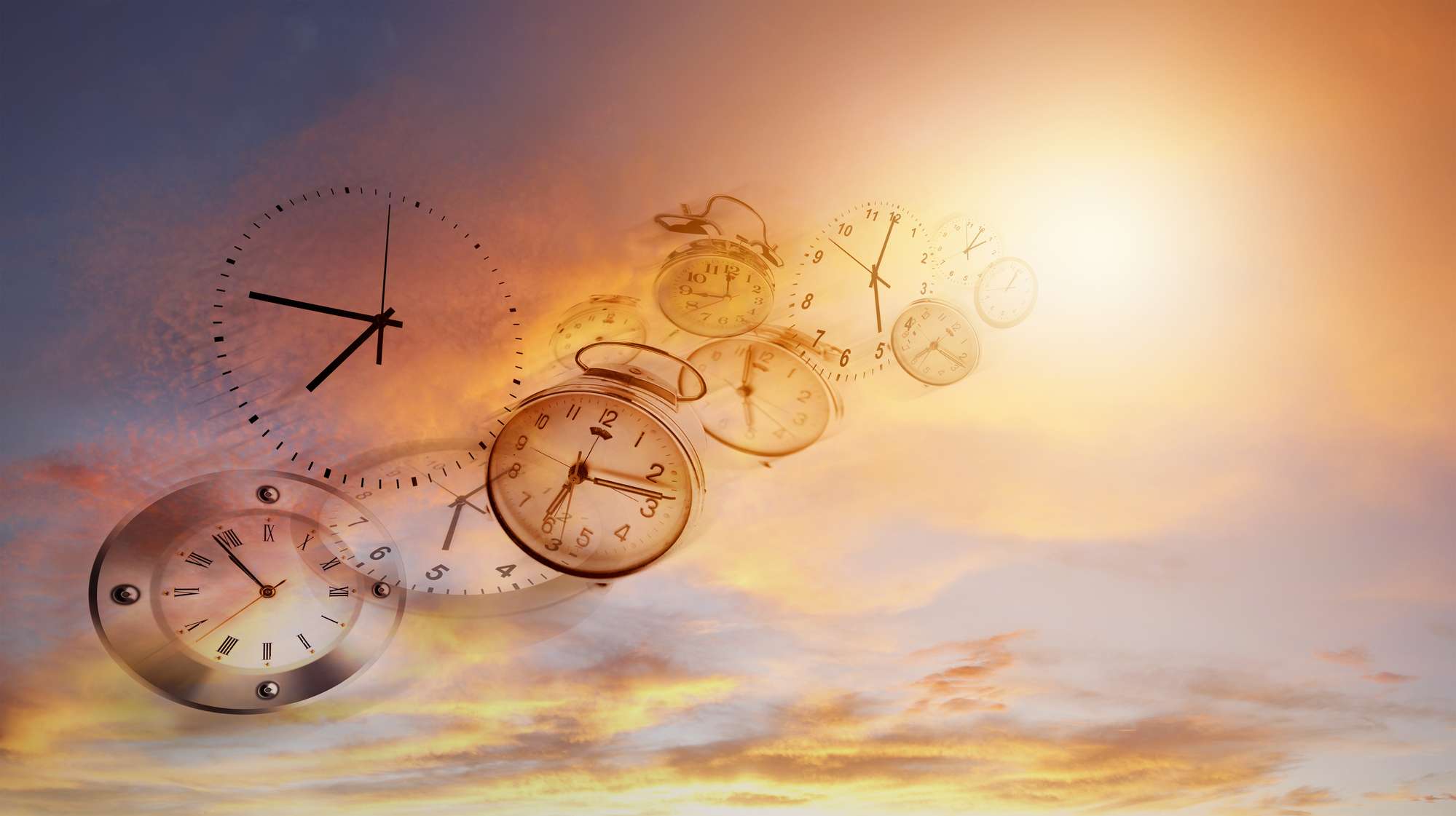 A group of clocks soaring through the sky during daylight.
