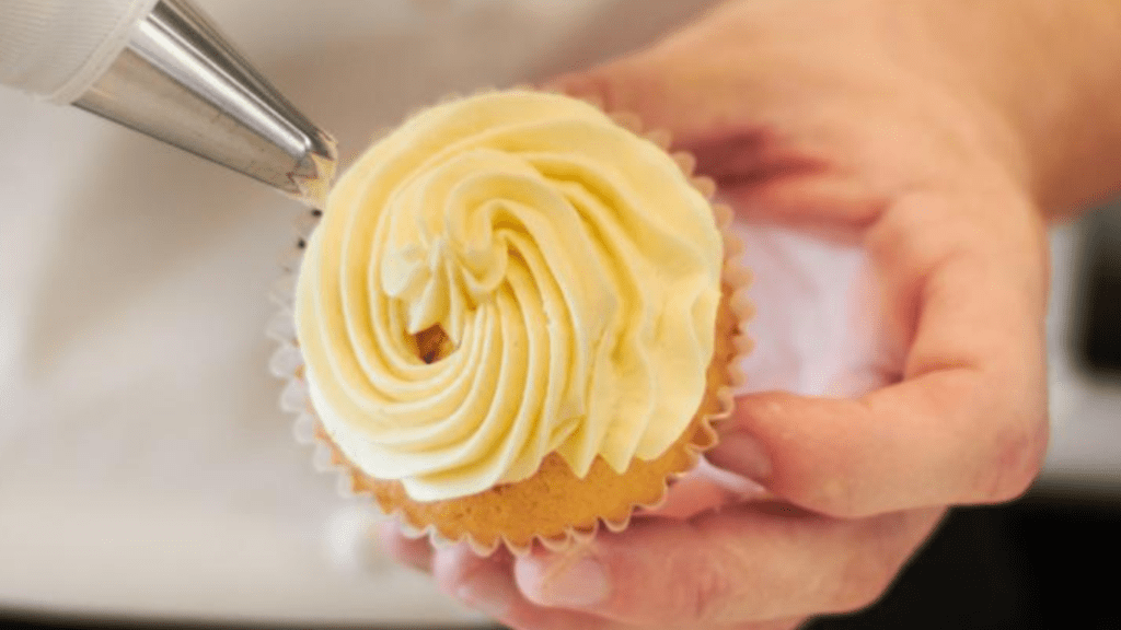 Using Your Lightbox to Beat the Winter Blues - cupcake analogy.  A hand holds a cupcake and is applying a thick layer of icing. 