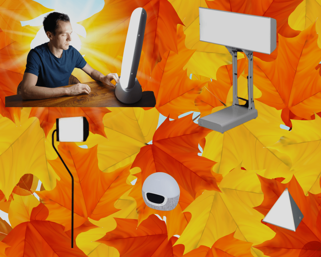 A man benefitting from light therapy while sitting at a desk with a light.